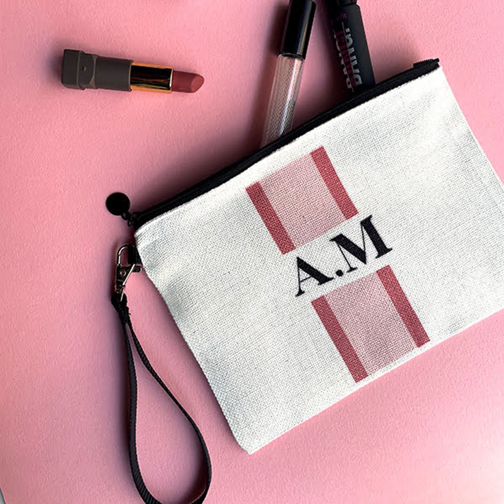 Pochette Beauty in juta con laccio da polso